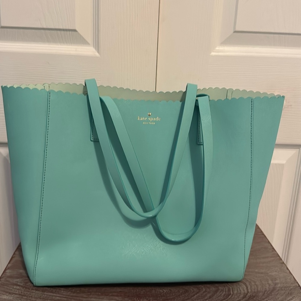 Kate Spade pop of color!  Has been well loved with a little wear.